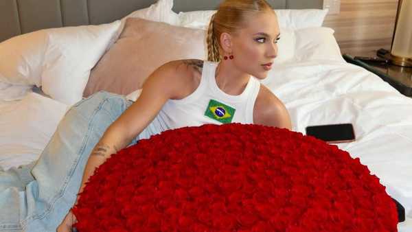 Virginia explica buquê de rosas e reage ao gol de Vini Jr.: "Feliz por ele"