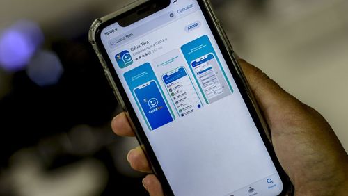Beneficiários do auxílio emergencial podem pagar compras via celular